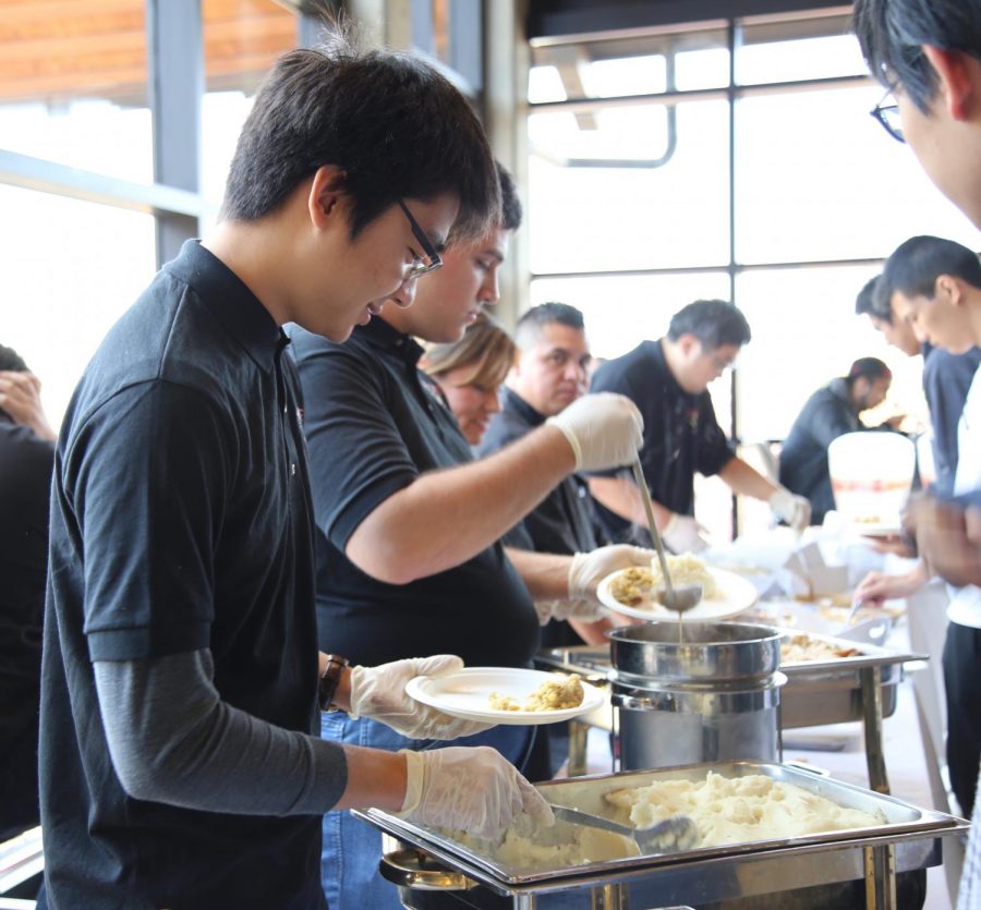 Food being doled out at the Thanksgiving Feast | Alex Chu.