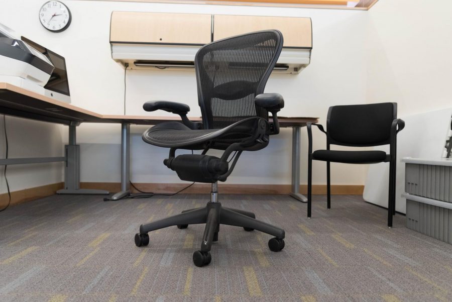 An empty rolling chair sits in an office at Foothill College.