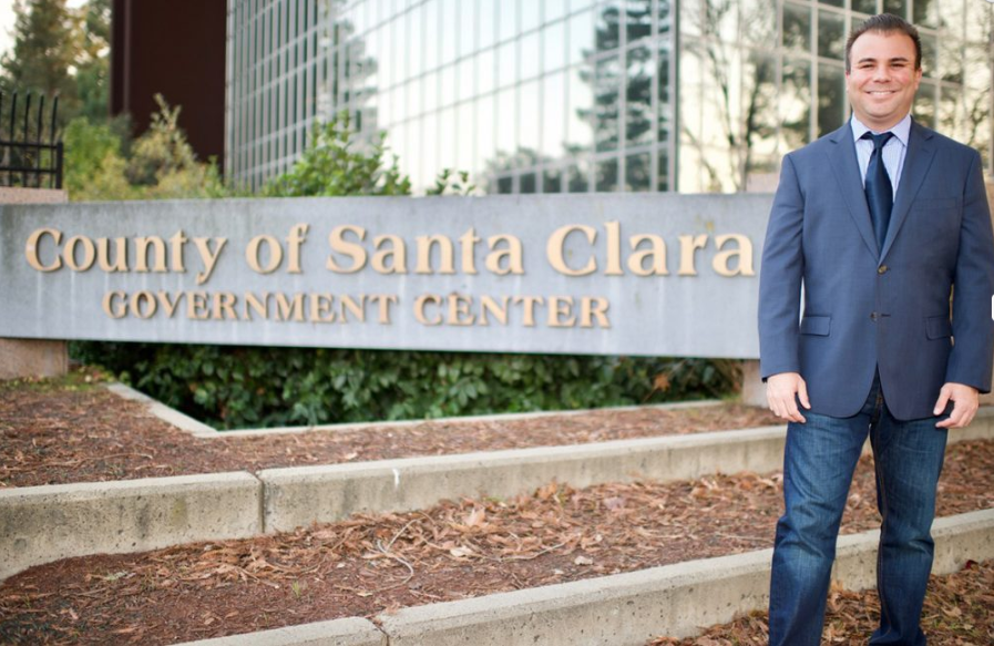 Dominic Caserta poses with city of Santa Clara sign.
