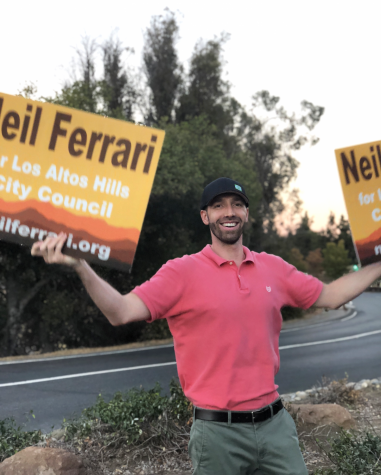Los Altos Hills Candidate Neil Ferrari stands on an island dividing traffic to campaign hours before voting finishes.