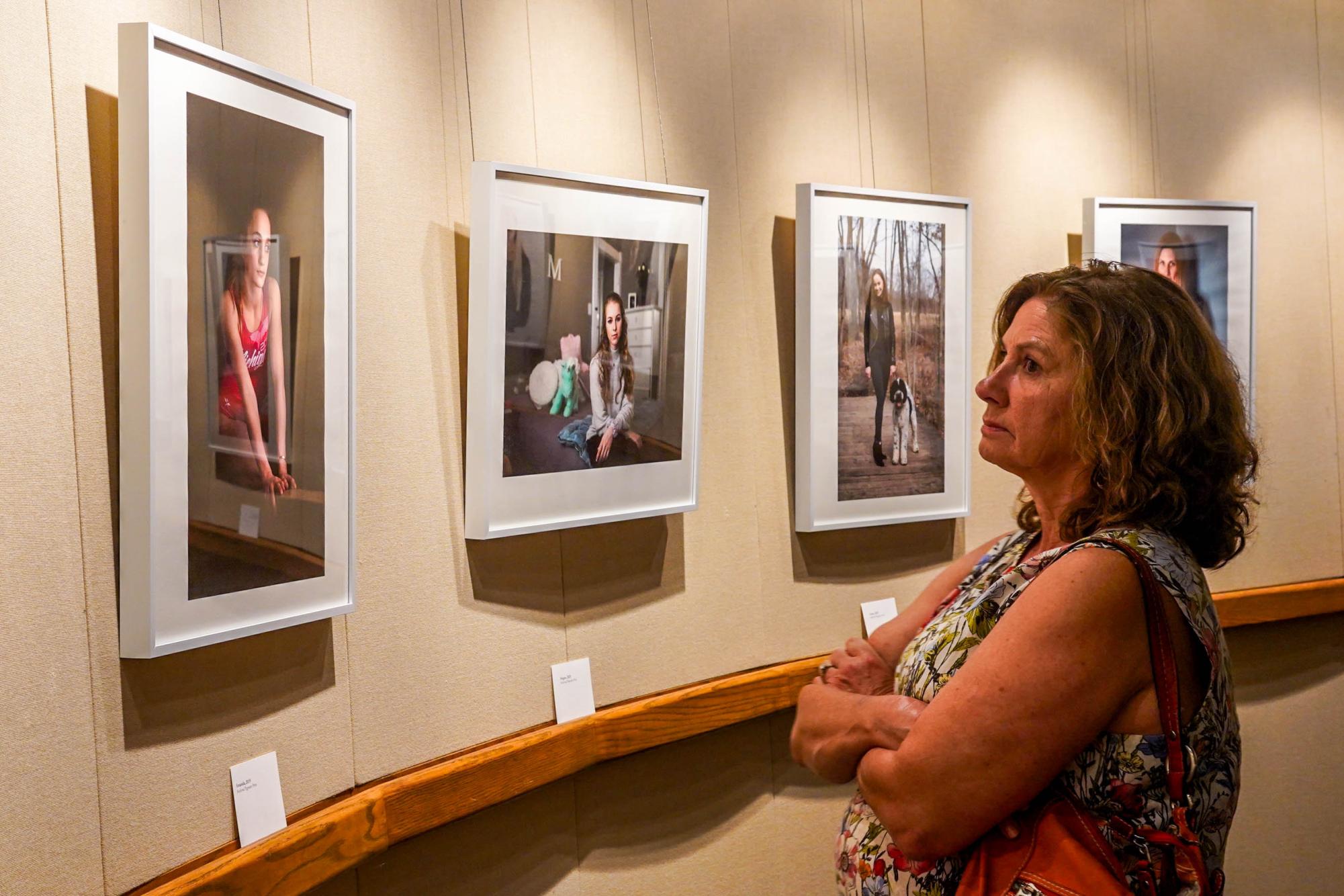 Participant takes in Judy Walgrens Photos