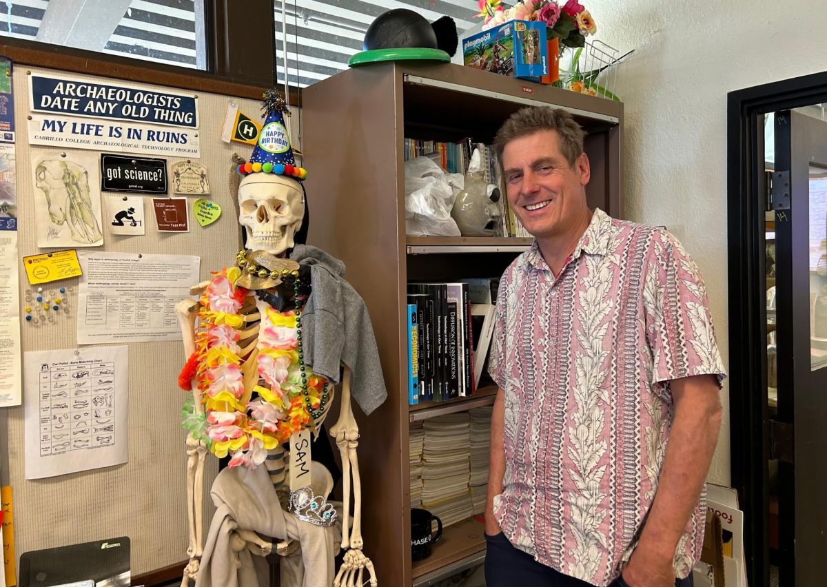 Professor Sam Connell poses with his buddy, Skeleton Sam
