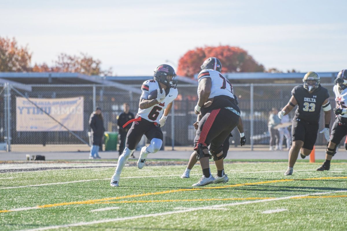 WR Johnnie Barbie gaining some yards after the catch vs San Joaquin Delta.