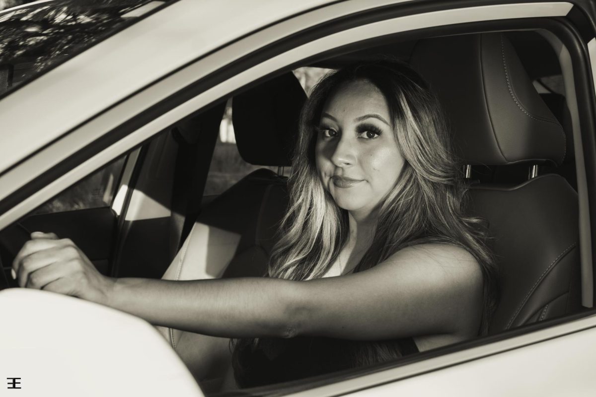 A girl can love cars just as much as a guy. This photo embraces the love for one's car even if they are a girl! It is set in black and white to give more depth to the image, and also give it a nice contrast. 