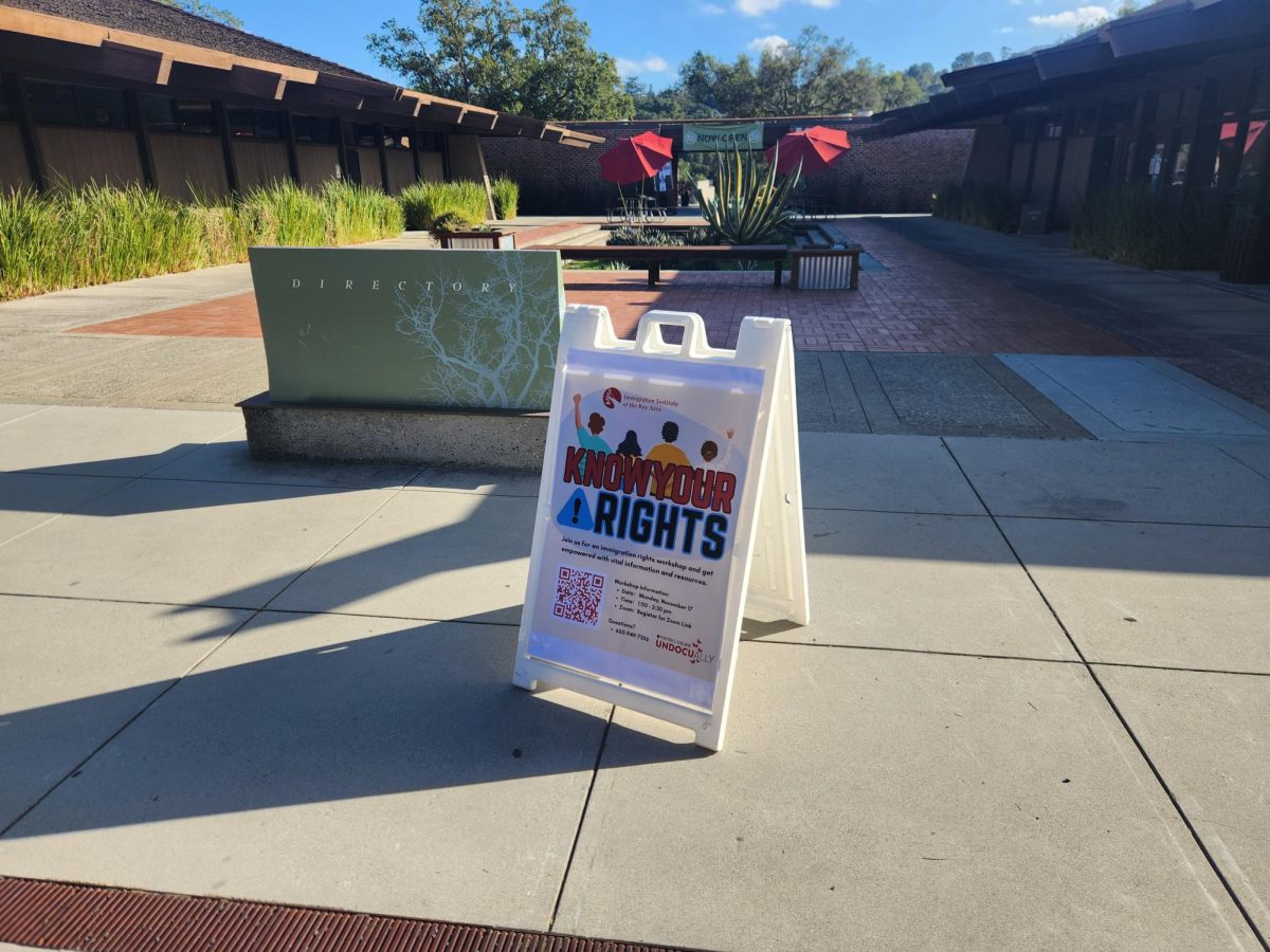 Sign spreading awareness of a local know your rights workshop in Foothill College