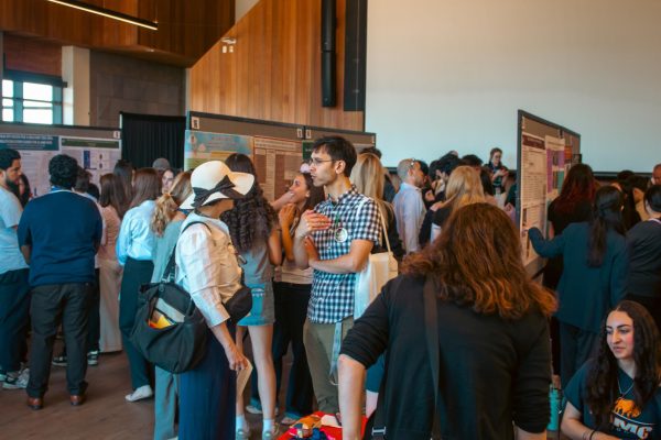 Presenters, students, staff, and other RSLS Visitors gather in the Foothill Dinning Hall to view the project posters and presentations. 